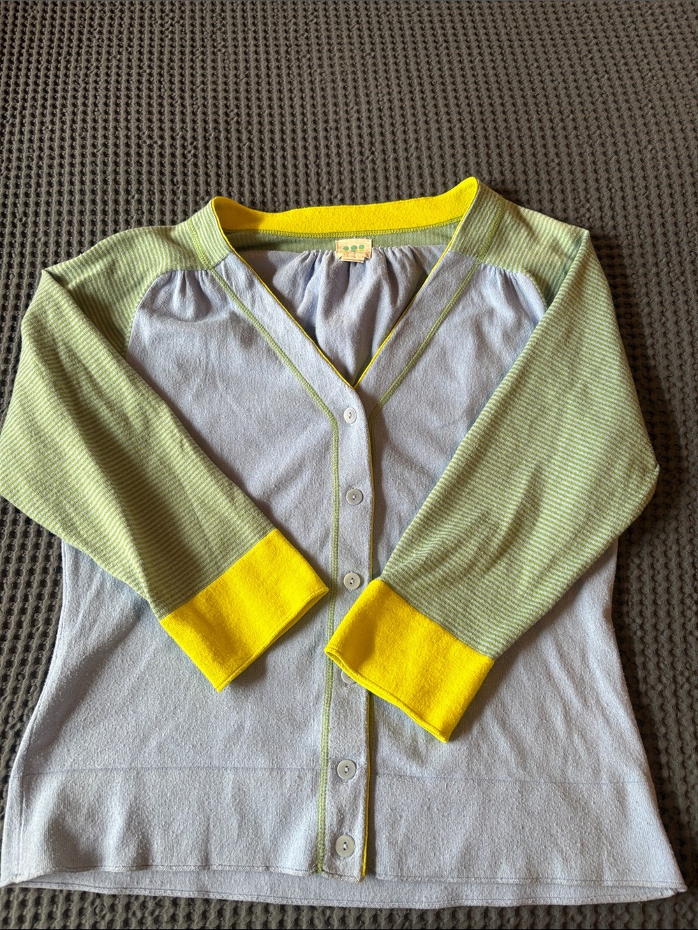 Title Nine Light Blue cardigan with green and yellow sleeves.